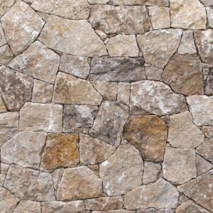 Fasádny sokel rodinného domu obložený prírodným žltým mramorom Rock Face Pearl Yellow na slnku.